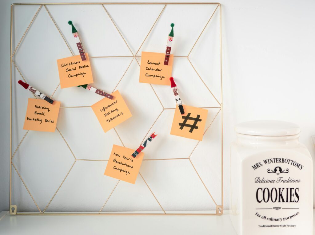 A wire grid displaying festive-themed notes for social media campaigns, perfect for holiday marketing.